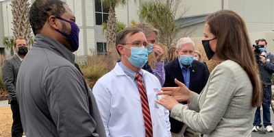Rep. Nancy Mace meeting with medical professionals at a drive-thru vaccination site
